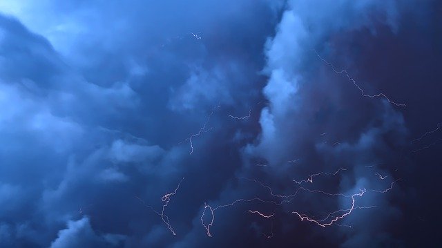 Image of dark blue and black clouds with lightening depicting a shame storm. 